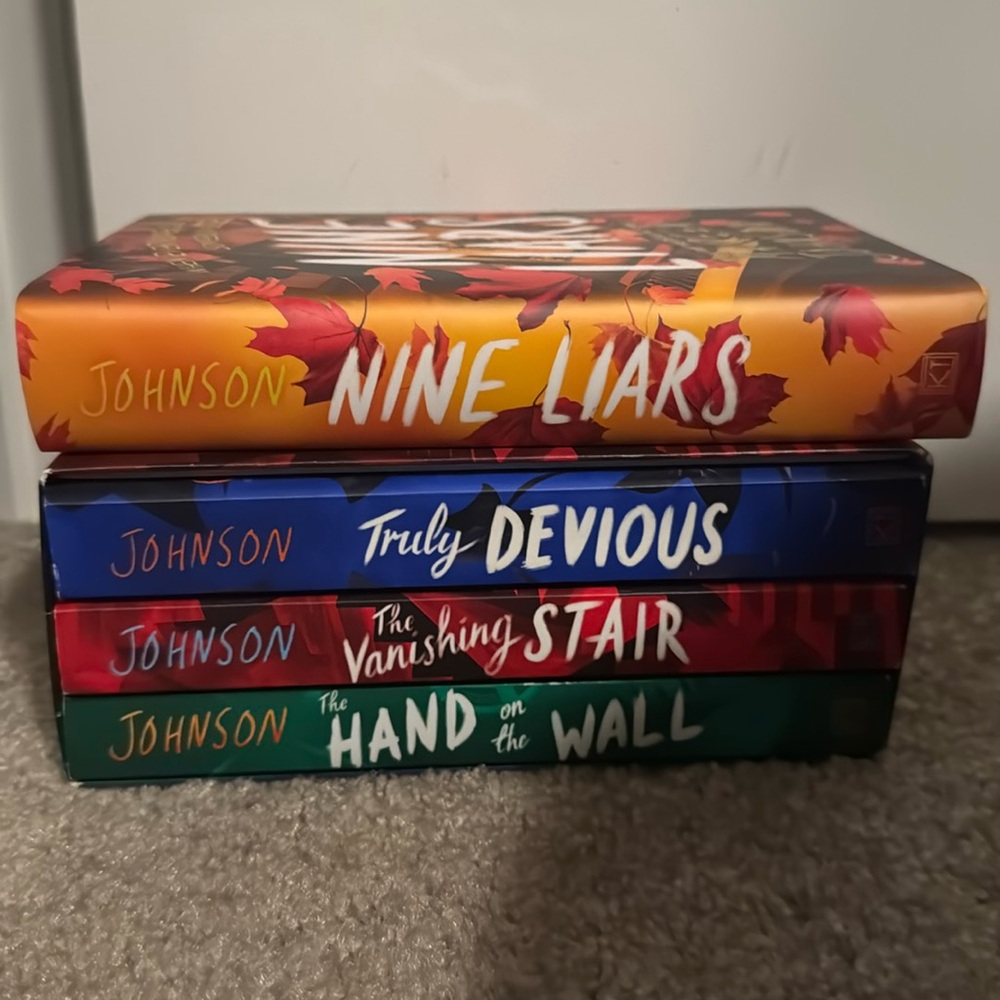 Truly Devious by Maureen Johnson book series. Three paperback and one hardcover